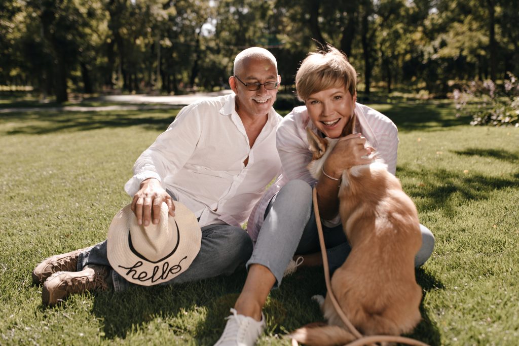 Couple with their dog enjoying an active retirement, reflecting Peptides Plus's wellness mission